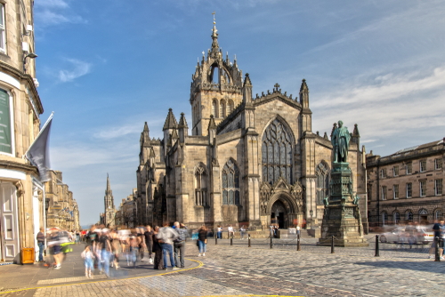 People walking in the square outside St. Giles Cathedral in Edinburgh, Scotland, United Kingdom