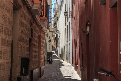 This is an narrow old street in the residential El Populo Barrio District in Cadiz, Andalusia, Spain