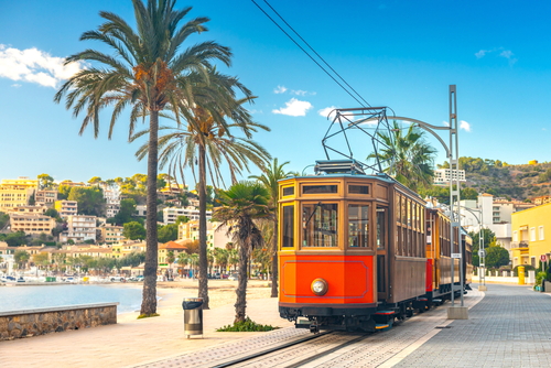 View of the Ferrocarril de Sóller, the famous orange tram runs from Soller to Port de Soller, Palma de Mallorca, Mallorca island, Balearic Islands, Spain