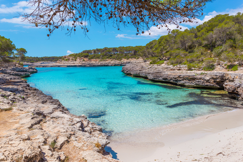 Beautiful beach with turquoise waters of a bay in the Mondrago Natural Park, Mallorca island, Balearic Islands, Spain