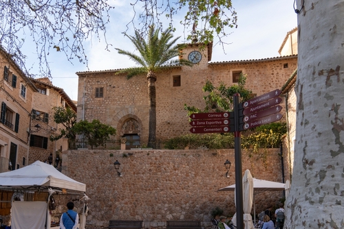 Main square with the church, the stone village in the Tramuntana mountains in an UNESCO World Heritage Site, Fornalutx village is located on Mallorca island, Balearic Islands, Spain