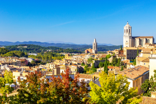 Girona Cathedral, also known as the Cathedral of Saint Mary of Girona, aerial view of Girona city in summer day with blue sky, Girona landmarks, Catalonia, Spain