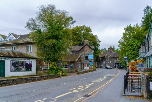 View of a street, with locals and visitors in Grasmere, the Lake District National Park, Cumbria, England, United Kingdom