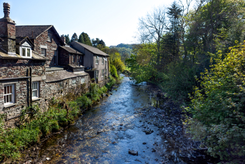 View of a stream running through Grasmere, the Lake District National Park, Cumbria, England, United Kingdom