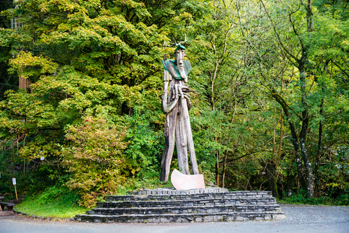 Ancient Forester sculpture at the entrance of the walking trails of the Grizedale Forest, the Lake District National Park, Cumbria, England, United Kingdom