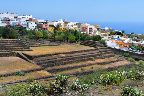 Pyramids of Guimar and the colorful houses of the town of Guimar in the background, Tenerife Island, The Canary Islands, Spain
