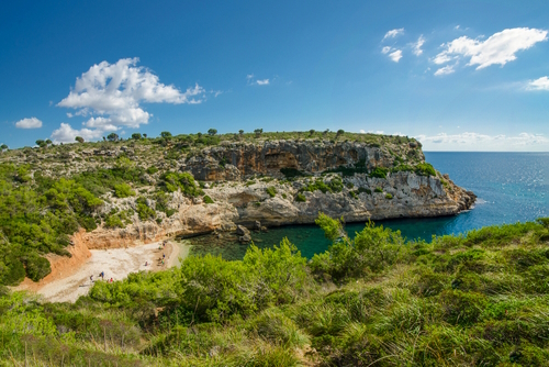 View of Cala Bota, a small cove of stones located near Cales de Mallorca, Mallorca Island, Balearic Islands, Spain