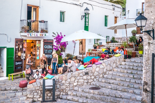View of people in the street of Ibiza old town, the Ibiza culture means to enjoy the life in the clubs and bars, Ibiza Island, Balearic Islands, Spain
