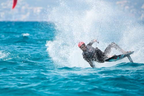 Rider trying to recover from a fall during the Rooster Formula Kite surfing Spain Series, Mallorca island, Balearic Islands, Spain