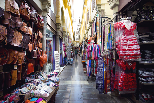 Alcaiceria Market in Granada, Andalusia, Spain. Narrow streets filled with shops called Alcaiceria, originally home to a Moorish silk market