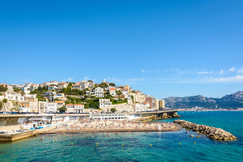 General view of the Prophet beach in Marseille, France, a very popular family beach located on the Kennedy corniche, on a hot and sunny spring day. Marseille, Provence, France