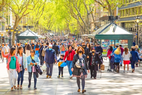 La Rambla busy street photo with many walking people. La Rambla is the most popular pedestrian street in Barcelona, Catalonia, Spain