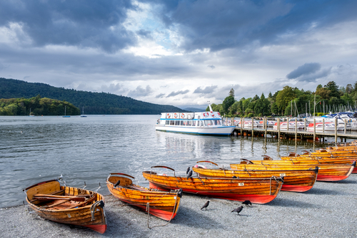 Boats on the bank of the beautiful lake Windermere in the Lake District National Park, Cumbria, England, UK