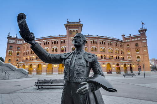 View of the sculpture of a bullfighter in front of the Las Ventas Bullring (Plaza de Toros de Las Ventas), a Neo-Mudejar (Moorish) style building situated in the Guindalera quarter of the district of Salamanca and home of bullfighting in Madrid, Spain