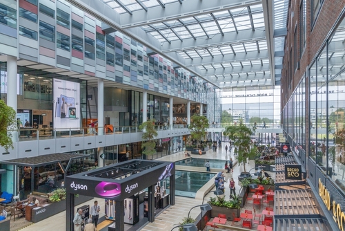 View of the so-called living room of shopping center Hoog Catharijne, the central square with terraces and catering in Utrecht, The Netherlands