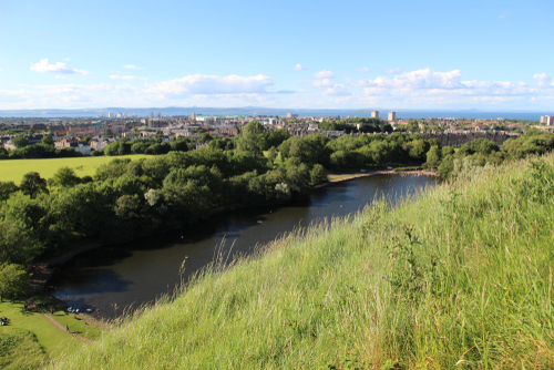 St Margaret's Loch Leith and the Forth River Seen Behind Grass on Top of a Hill in Holyrood, Edinburgh, Scotland, United Kingdom