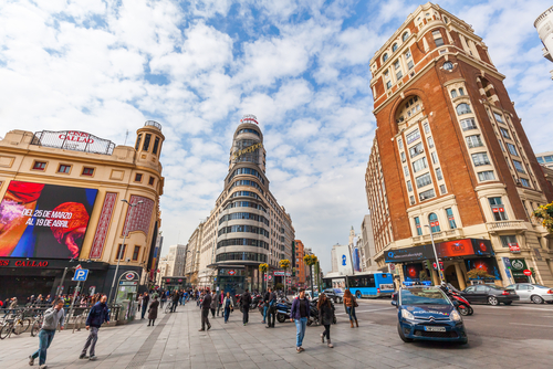 Plaza del Callao with people, the city square lies in the middle of the famous shopping street Gran Via and was developed between 1910 and 1940, Madrid, Spain