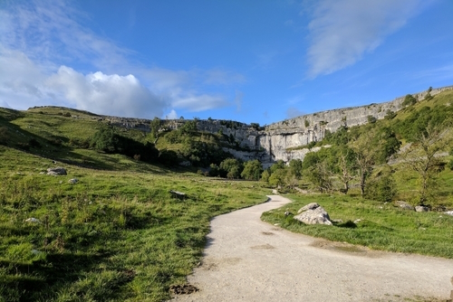 Path leading along Malham Beck to the bottom of Malham Cove, Yorkshire Dales National Park, Yorkshire, England, United Kingdom