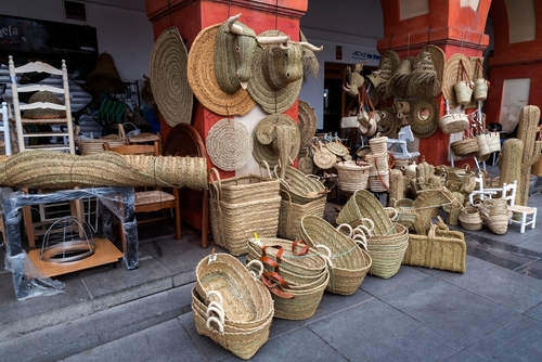 Wicker objects on sale at Corredera Square in Cordoba, Andalusia, Spain