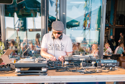 DJ Playing at the NDSM Wharf, ity-sponsored art community called Kinetisch Noord, center for underground culture in Amsterdam with beach hotels and restaurants, Holland