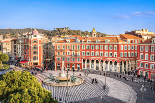 Aerial view of Place Massena square with red buildings and fountain in Nice, Cote d'Azur, France