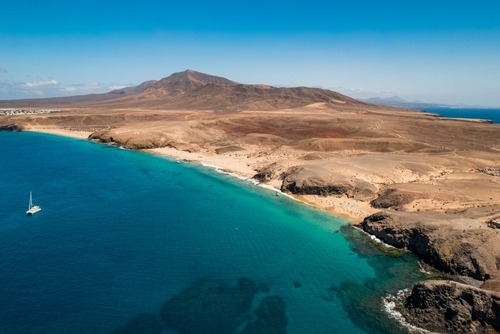 Scenic view of Papagayo Beach and the surrounding volcanic landscape in Costa Blanca, Yaiza, Lanzarote Island, Canary Islands, Spain