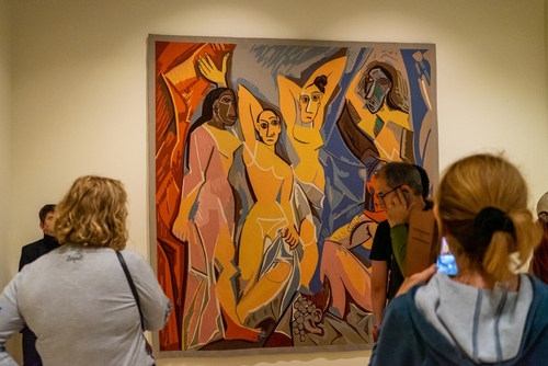 People viewing a painting by Picasso at the Picasso museum in Malaga, Andalusia, Spain
