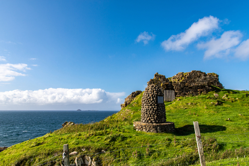 Beautiful view onto the Duntulm Castle, its meadows, its hills and its cliffs, Portree, Isle of Skye, Scotland, United Kingdom