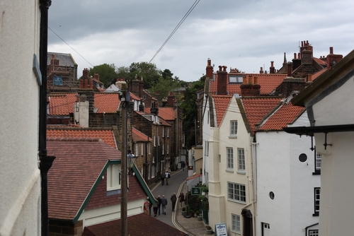 View of village centre houses and shops in Robin Hood's Bay, North York Moors National Park, Yorkshire, England, UK