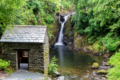 Waterfall at Rydal Hall House and Gardens, the gardens where designed by Sir Daniel Fleming in 1700, Rydal, Ambleside, the Lake District National Park, Cumbria, England, UK