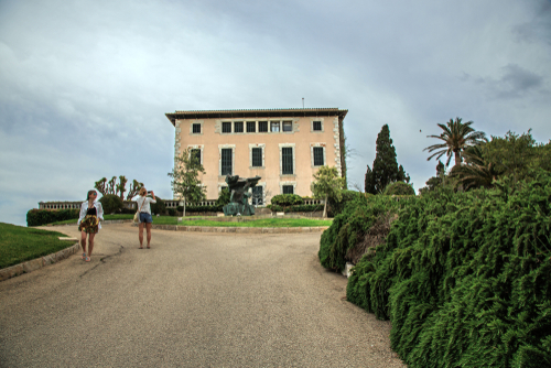 Tourists in Front of Sa Torre Cega (The Blind Tower), Cala Rajada, Mallorca island, Balearic Islands, Spain