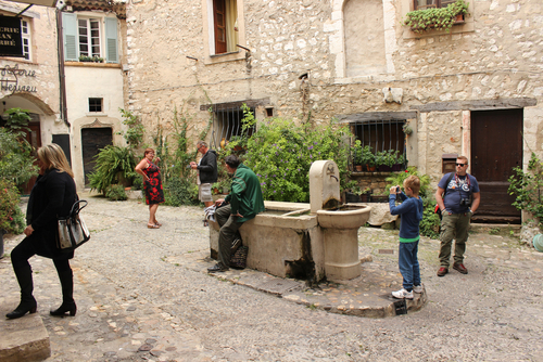 People visiting the exquisite medieval hilltop village of Saint Paul de Vence in the French Riviera, Cote d'Azur, France. Well known for its modern and contemporary art museums and galleries