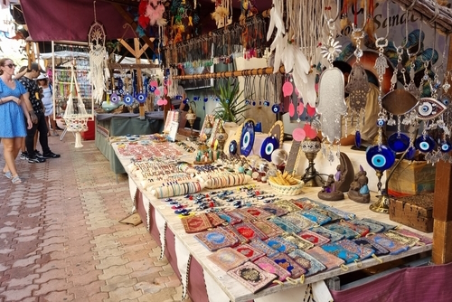 View of people observing homemade products on stands at the Medieval Fair of Sant Antoni de Portmany, Ibiza Island, Balearic Islands, Spain