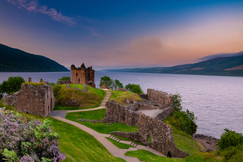 Urquhart Castle at sunset located on the banks of Loch ness, Scotland, UK