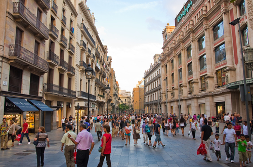 People walking through a shopping street in Barcelona, Catalonia, Spain
