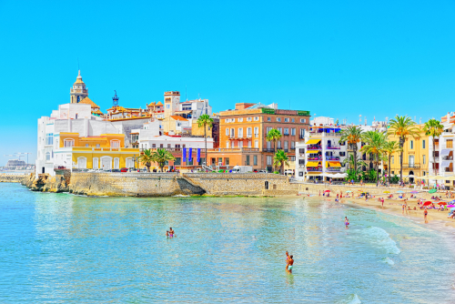 View of the beach and the sea shore of a small resort town Sitges in the suburbs of Barcelona, Catalonia, Spain