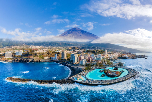 Aerial view of Puerto de la Cruz, with the Teide volcano in the background, Tenerife island, Canary Islands, Spain