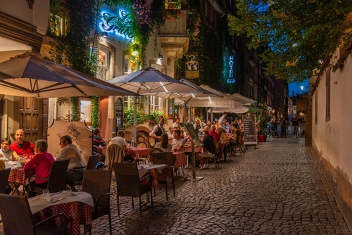 Night view of restaurants on a street in the old town of Strasbourg, Alsace, France