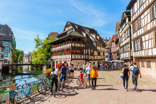 View of the quarter La Petite France with unidentified people. In the middle ages it was the home for tanners, millers and fishermen. It is a main landmark in Strasbourg, Alsace, France