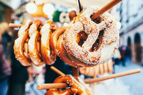 Pretzels with sesame on holder at Christmas market in Strasbourg, Alsace, France