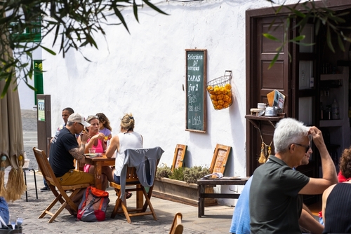 Street view of a local restaurant with diners in Teguise, Lanzarote Island, The Canary Islands, Spain