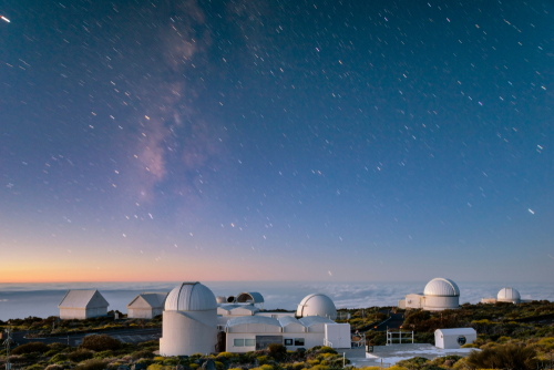 Starry sky night above the astronomical observatory in the Teide volcano National Park on Tenerife island, The Canary Islands, Spain