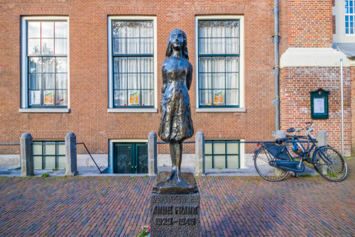 Statue of Anne Frank by Pieter d'Hont, next to Anne Frank House in Amsterdam, The Netherlands