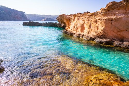 View of the Cala Xarraca in Sant Joan with its crystal clear turquoise waters, Ibiza island, Balearic Islands, Spain