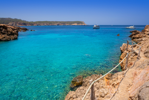 View of the secluded Cala Xuclar beach of Ibiza in Sant Joan with its crystal clear turquoise waters, Ibiza island, Balearic Islands, Spain