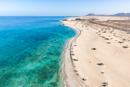 Aerial view of Corralejo National Park (Parque Natural de Corralejo) with sand dunes located in the northeast corner of the island of Fuerteventura, The Canary Islands, Spain