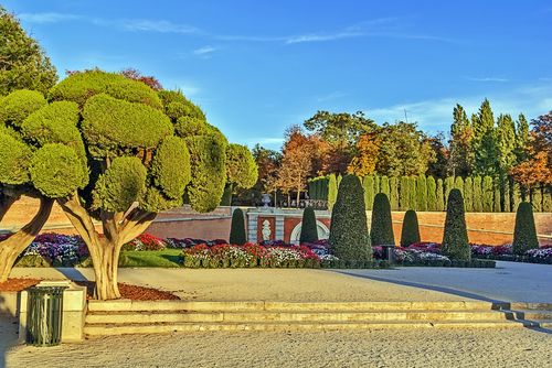 Flower beds and topiary at the Buen Retiro Park, one of the largest parks of the city of Madrid, Spain