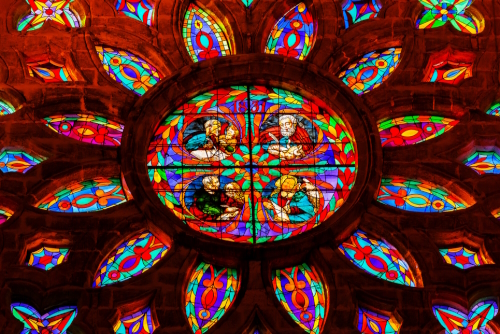 Gospel Writers in Stained Glass Rose Window in Seville Cathedral, Cathedral of Saint Mary of the Sea in Seville, Andalusia, Spain