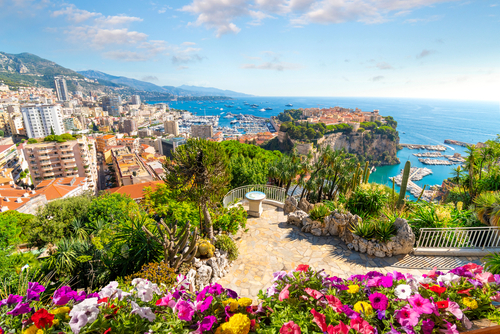 View of the city of Monte Carlo including the Rock, marina, Mediterranean Sea and cityscape along the coast of Monaco from the Exotic Garden of Monaco (Jardin Exotique de Monaco) in the French Riviera, Cote d'Azur, France
