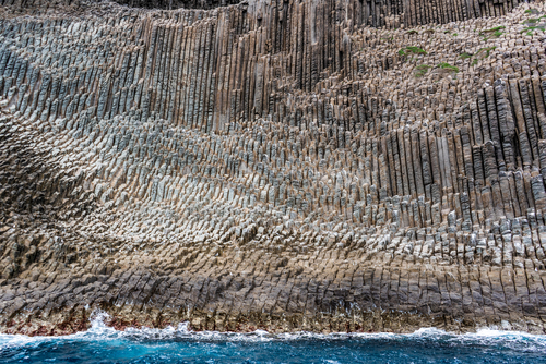 Close-up view from the sea of the volcanic rock formation, Los Organos, La Gomera island, The Canaries, Spain